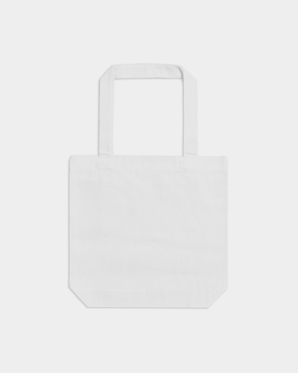 next image of American Apparel® Heavyweight Canvas Tote Bag : White tote bag on a light gray background-white